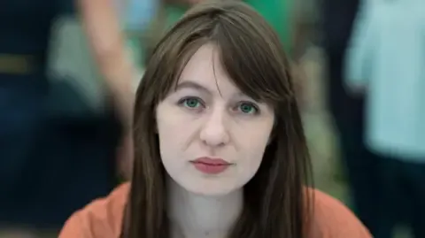 Irish author Sally Rooney declares she will not travel to the UK over potential arrest