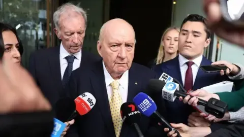 Sex Abuse Accusations Against Top Australian Media Personality Downgraded